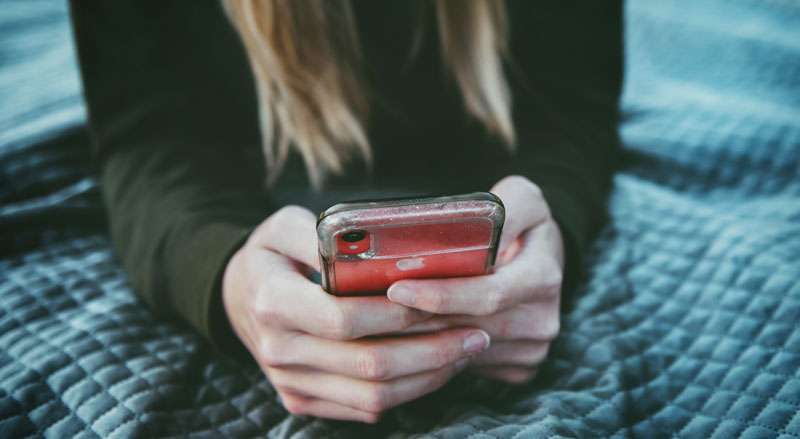 girl checking her mobile phone