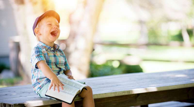 happy boy laughing out loud