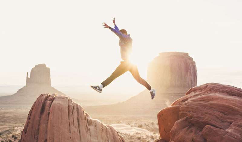 man jumping with confidence