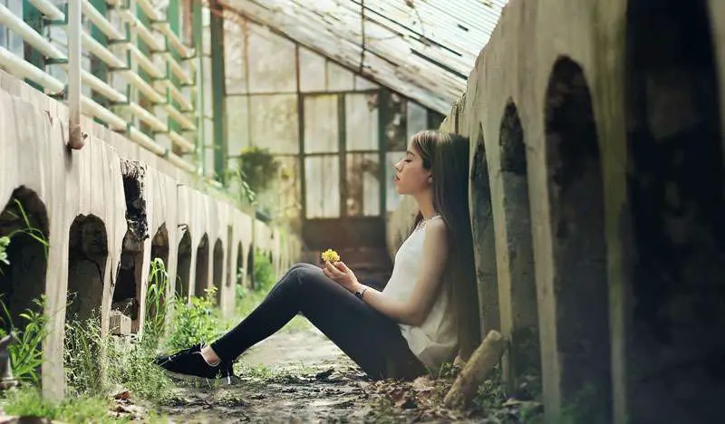 sad girl seated on the floor