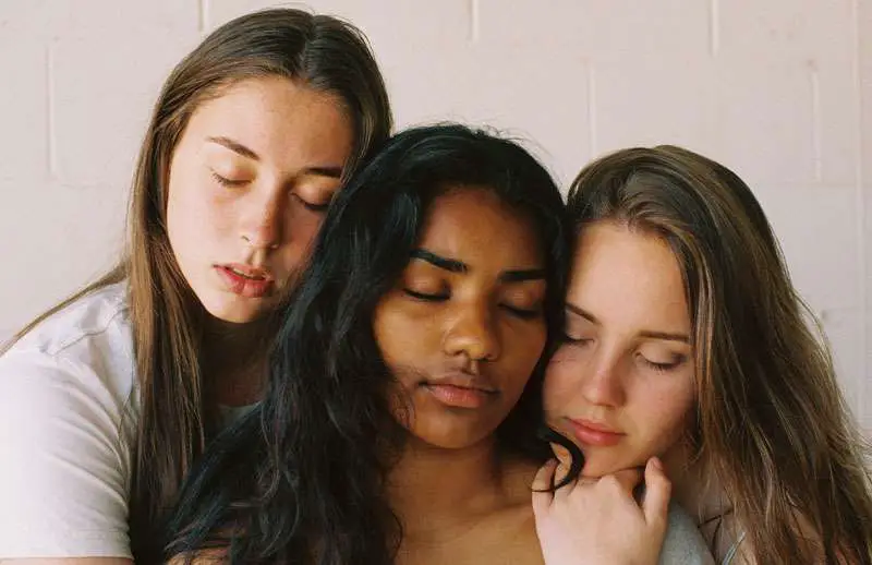 girls comforting their friend