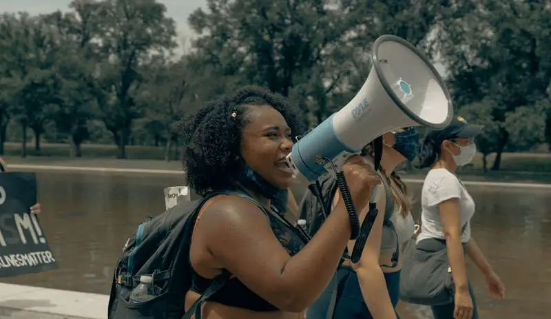 afro american woman using a megaphone