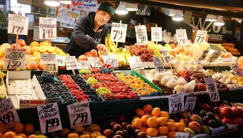 hispanic man selling fruits