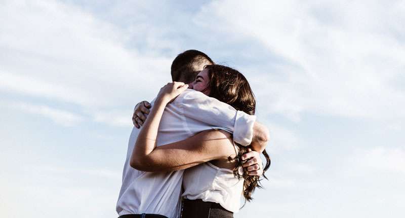 white girl hugging her friend