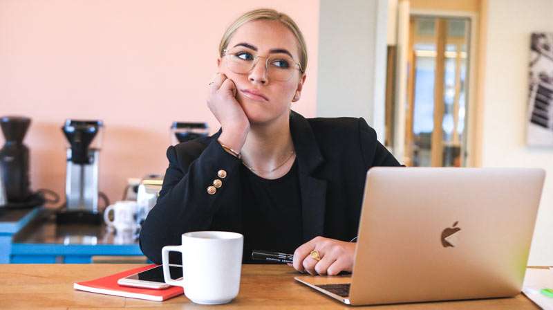 lazy girl facing her computer