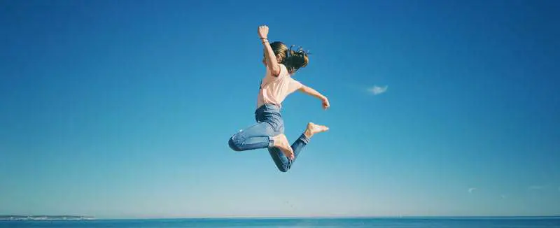 girl jumping and ready to live
