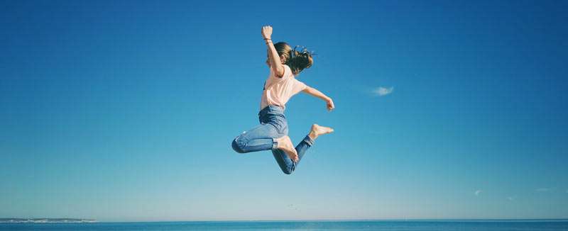 girl jumping and ready to live