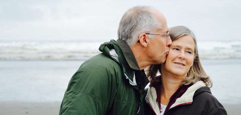 man kissing his wife