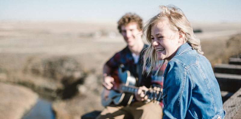 couple enjoying music outside