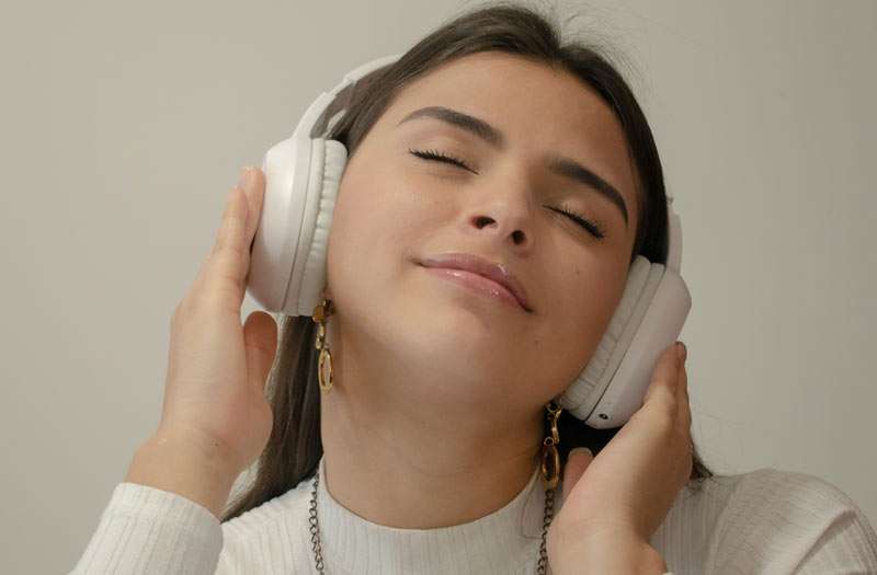 girl feeling happy with music