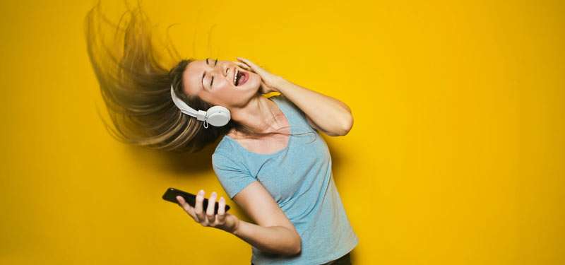 woman listening to music and dancing