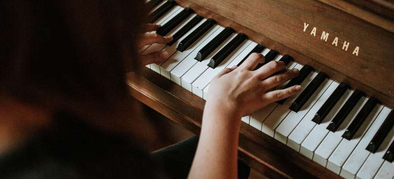 woman playing piano