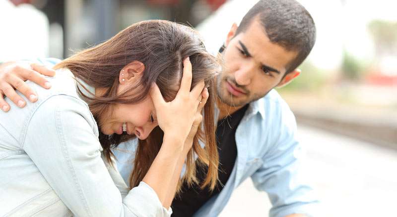 man comforting his friend after a breakup