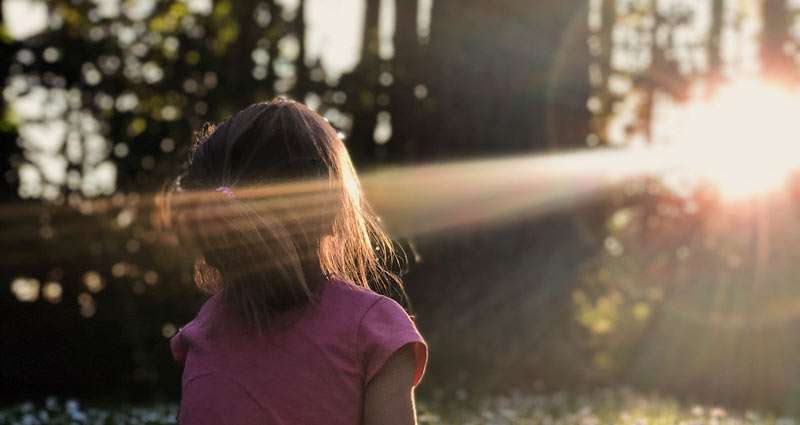 child enjoying the sun