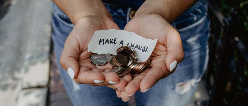 person donating money for charity