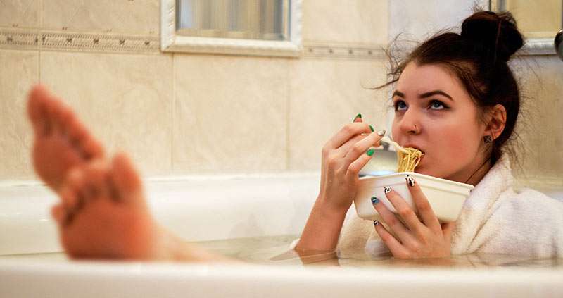 girl taking a bath with her bathrobe