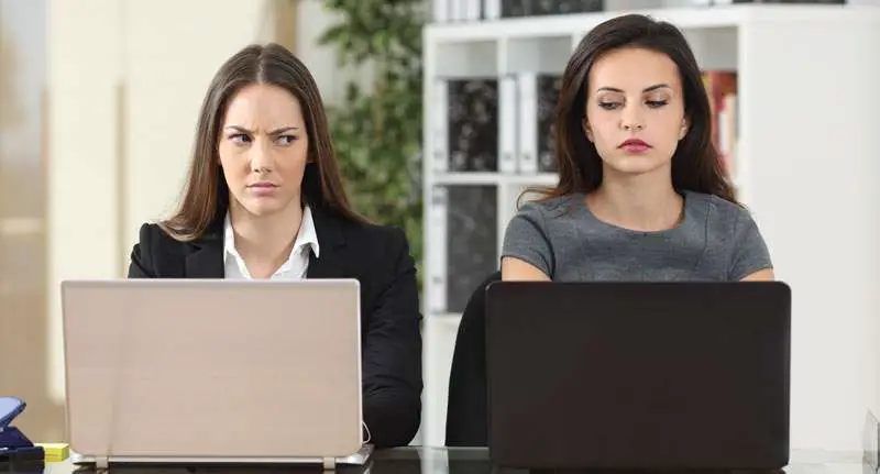 woman feeling the jealousy of her colleague