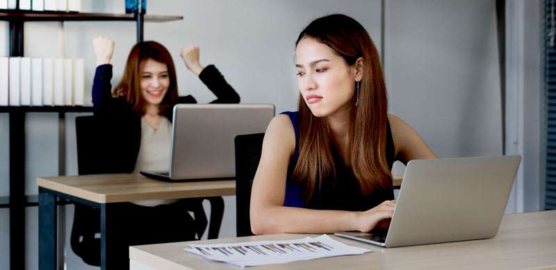 woman feeling jealous of her coworker