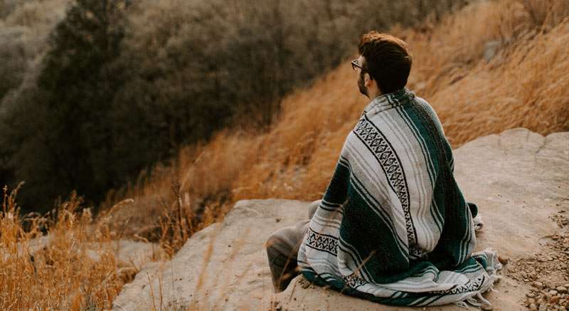 man outdoors enjoying the view