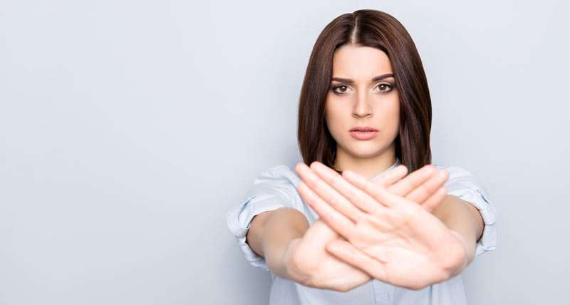 woman saying no with her hands