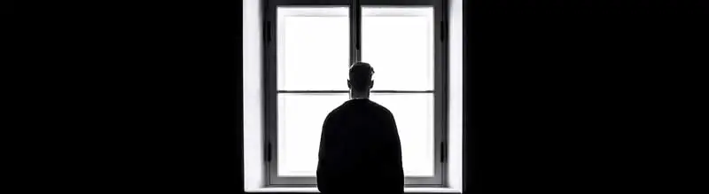 man looking through the window