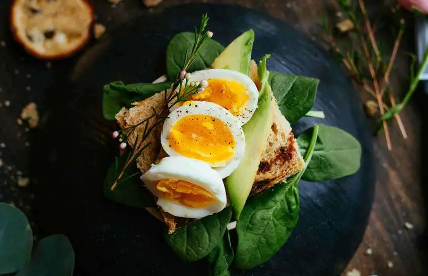 eggs on a toast with salads