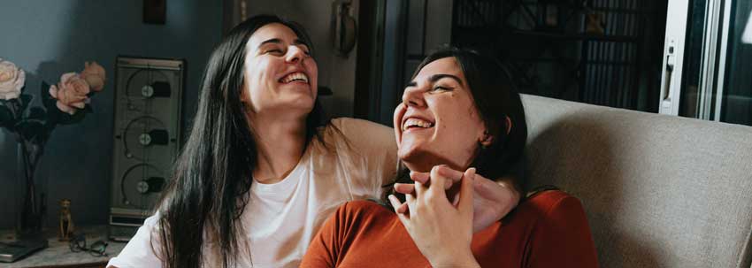 lesbian couple on a couch