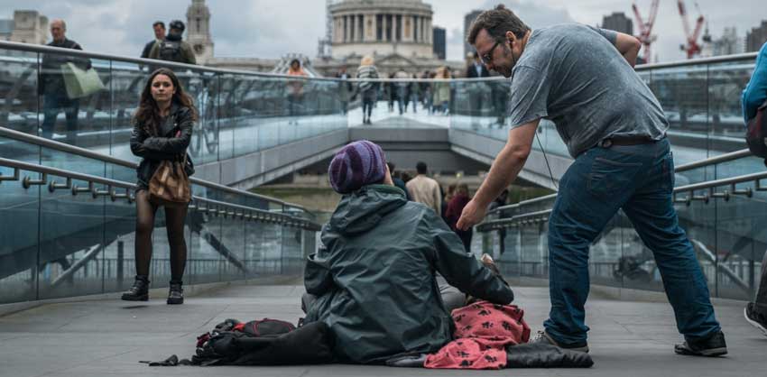 person being kind to a beggar