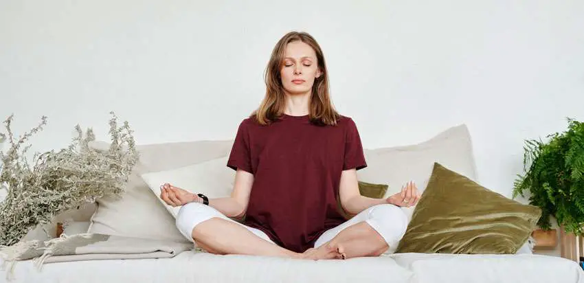 person focusing on her meditating