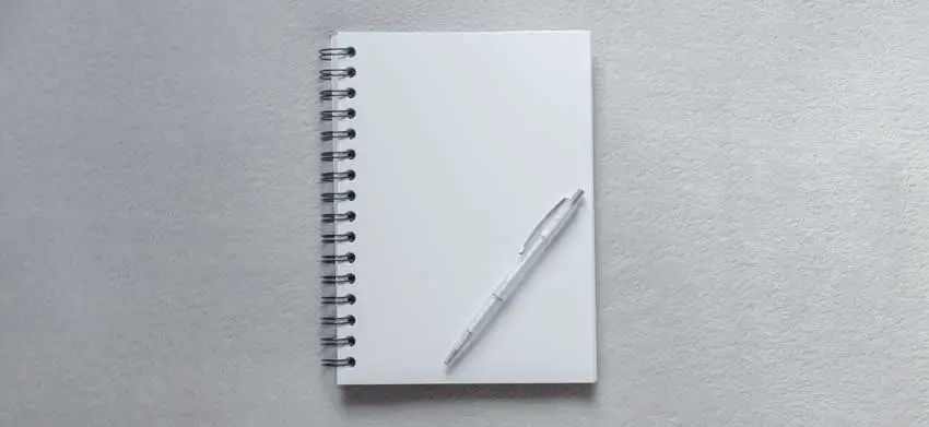 white journal with a pen