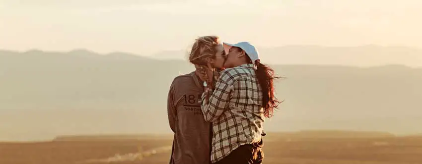 couple kissing in a desert