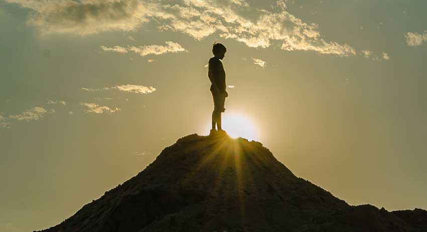 person on the top of a mountain